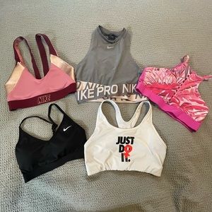 4 Nike Sports Bras- All size M except black bra. Black Bra is a S.